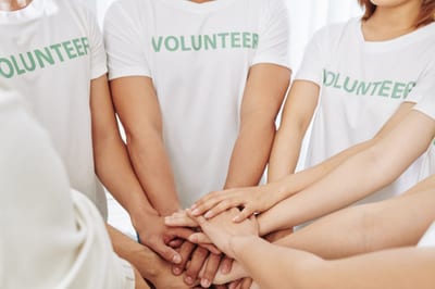 Volunteers stacking hands